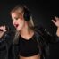 female singer with headphones singing