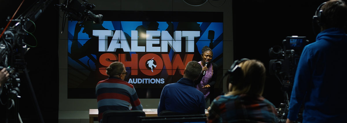 Young woman singing in a talent show