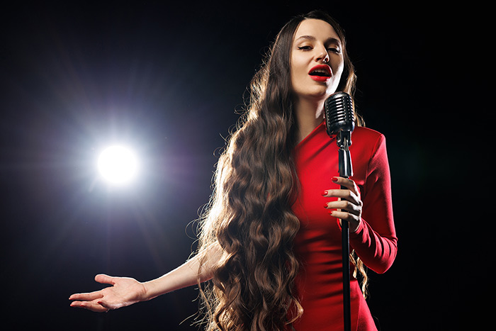 Lady in red dress singing
