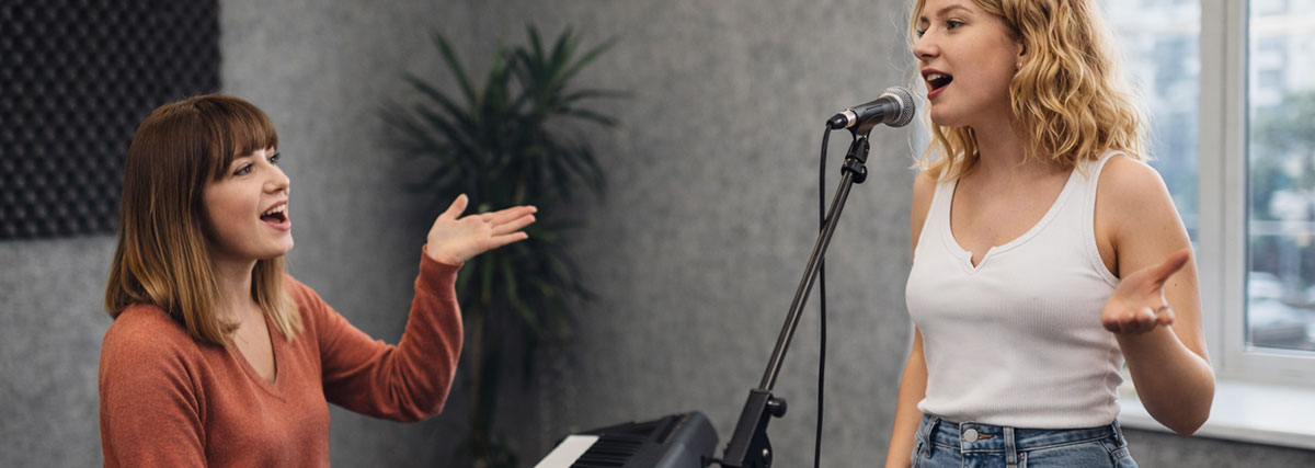 Teacher and student in a singing class