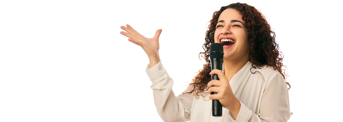 Woman with curled hair singing with smile