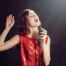 Woman with red dress singing