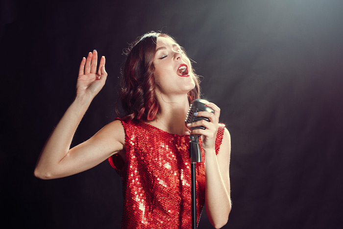 Woman with red dress singing