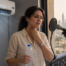 Singer experiencing vocal dryness from Dubai air conditioning during a vocal practice session