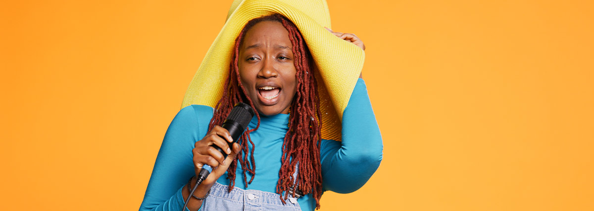 Singing woman with hat orange background