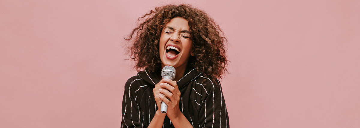 Woman with curl hair singing loud
