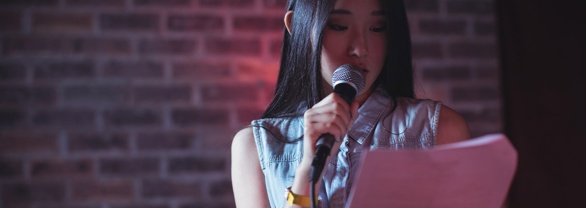 Female singer practising English vowel sounds and clear pronunciation
