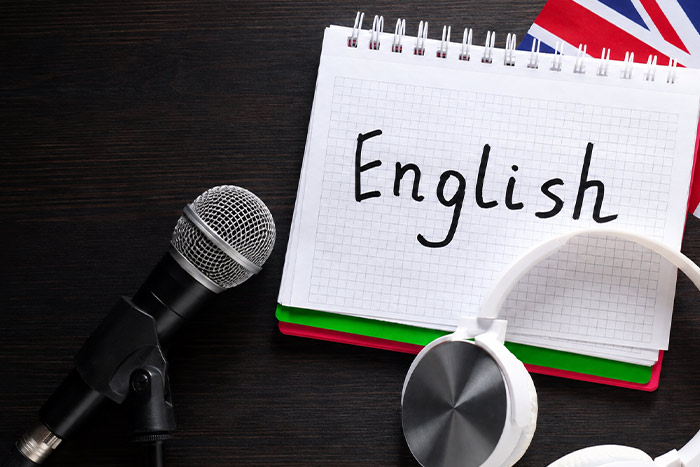 Microphone, headphones and British flag representing singing in English